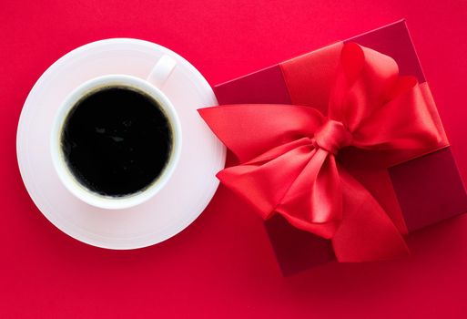 Romantic celebration, lifestyle and birthday present concept - Luxury beauty gift box and coffee on red, flatlay