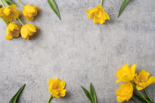 Concept of Mother's day holiday greeting design with yellow tulip flower bouquet on gray background