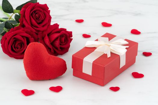 Valentine's Day design concept background with rose flower and gift box on marble white background