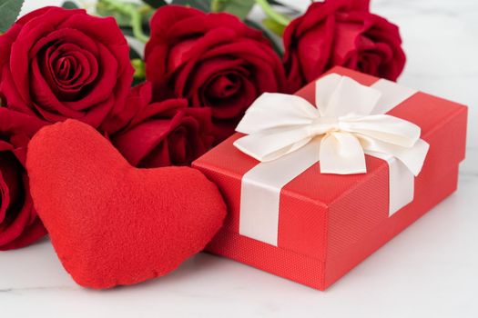 Valentine's Day design concept background with rose flower and gift box on marble white background
