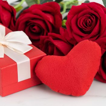 Valentine's Day design concept background with rose flower and gift box on marble white background
