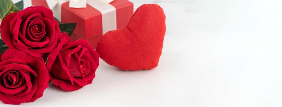 Valentine's Day design concept background with rose flower and gift box on marble white background