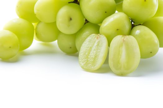 Close up of beautiful a bunch of Shine Muscat green grape isolated on white background, clipping path cut out.