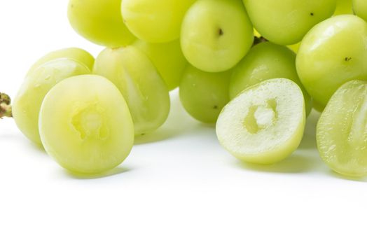 Close up of beautiful a bunch of Shine Muscat green grape isolated on white background, clipping path cut out.