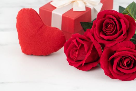 Valentine's Day design concept background with rose flower and gift box on marble white background