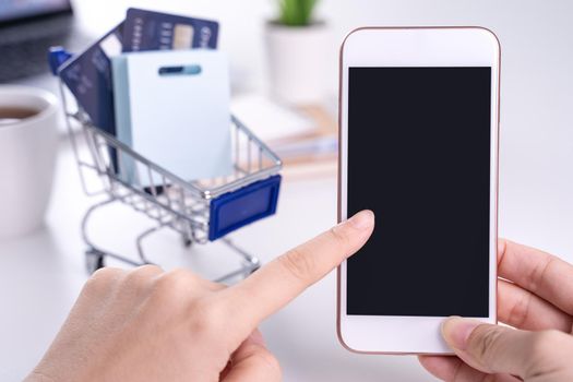 Woman using holding smart mobile phone staying home online electronic payment