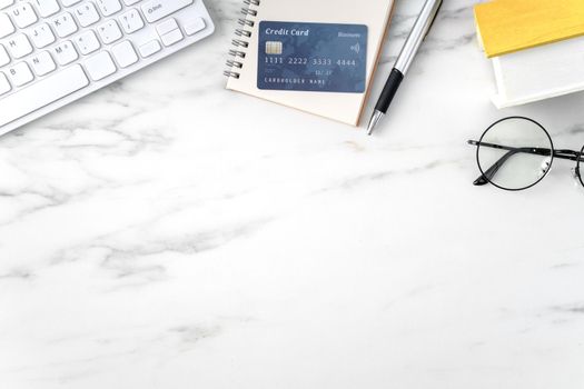 Top view of estimating and paying house tax with calculator and credit card from internet.