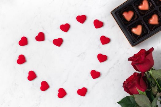 Top view of Valentine day chocolate with rose and wine, festive gift design concept for special holiday dating.