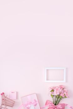 Mother's Day, Valentine's Day background design concept, beautiful pink carnation flower bouquet on pastel pink table, top view, flat lay, copy space.