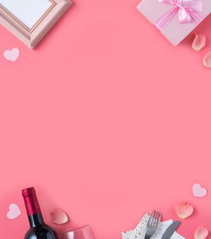 Valentine's Day design concept background with pink petals and gift box on pink background