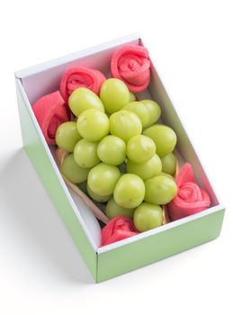 Close up of beautiful boxed Shrine Muscat green grape isolated on white background, clipping path cut out.