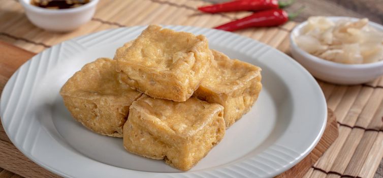 Deep fried stinky tofu, fermented bean curd with pickled cabbage vegetable, famous and delicious street food in Taiwan.
