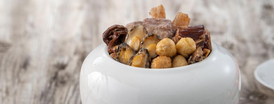 Traditional food of Chinese lunar new year, Buddha jumps over the wall, Chinese Soup Casserole dish, Buddha's Temptation, named Fo Tiao Qiang, close up.