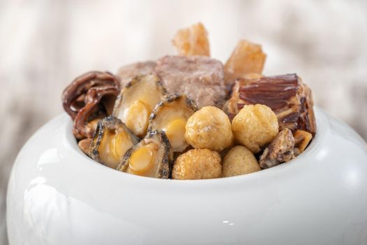 Traditional food of Chinese lunar new year, Buddha jumps over the wall, Chinese Soup Casserole dish, Buddha's Temptation, named Fo Tiao Qiang, close up.
