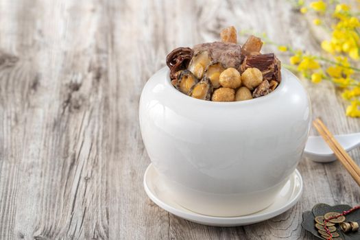 Traditional food of Chinese lunar new year, Buddha jumps over the wall, Chinese Soup Casserole dish, Buddha's Temptation, named Fo Tiao Qiang, close up.