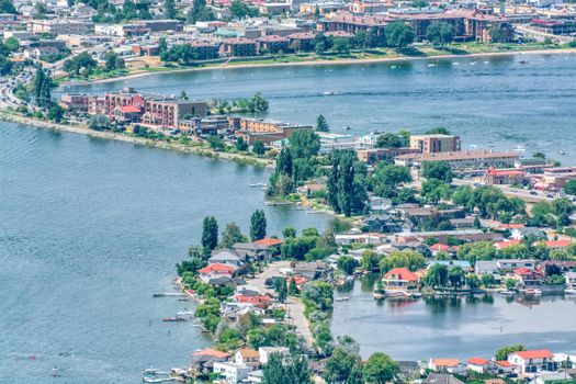 Fly overview of resort area and residential houses in Osoyoos town, British Columbia