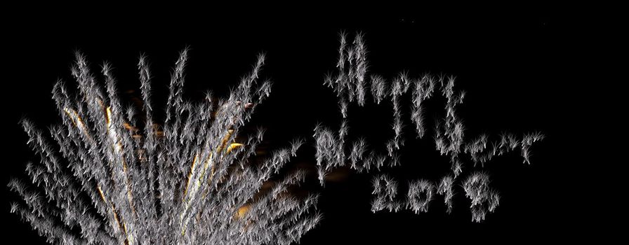 amazing fireworks in the black sky, with handwritten wishes Happy New Year 2018, grand spectacle at the beginning of the new year, party