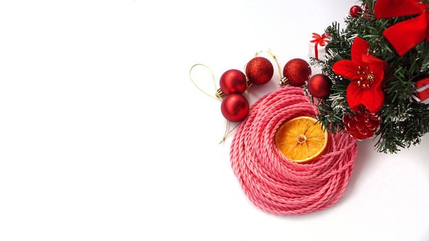 Synthetic pink kanekalon braids - Christmas photo with decoration on white. New Year photo for a store or hairdressing salons, barbershops