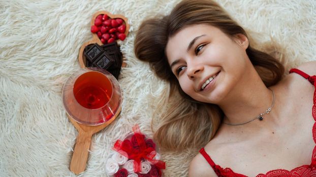 Romance, valentine day gifts concept. Beautiful blonde woman on sofa with gifts