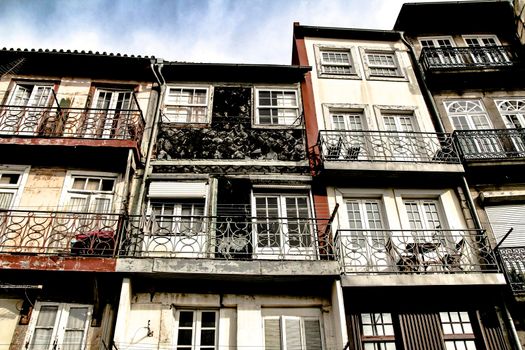 Beautiful and old colorful tiled facades in Porto city in January