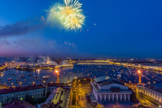 Festive salute over the Peter and Paul Fortress in a significant Victory Day for the country on May 9, improbable quantity of ships observes a show, an eternal flame of memory burns on rostral colons. High quality 4k footage