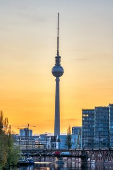 The famous Television Tower and the river Spree in Berlin at sunset