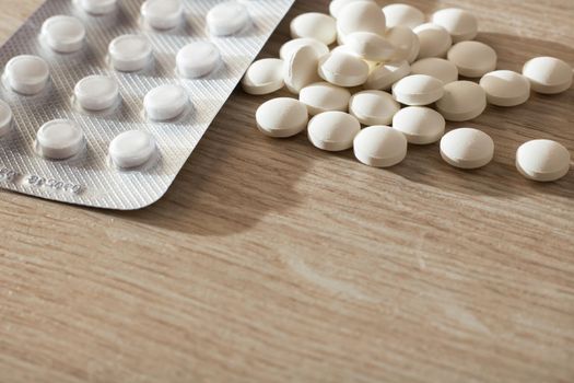 The blister with pills and round pills with copy space