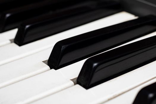 Piano keys close up, top view, background, black and white