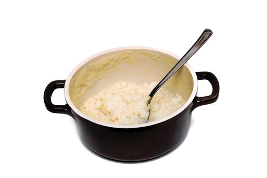 Rice porridge and spoon in pan, isolate on a white background