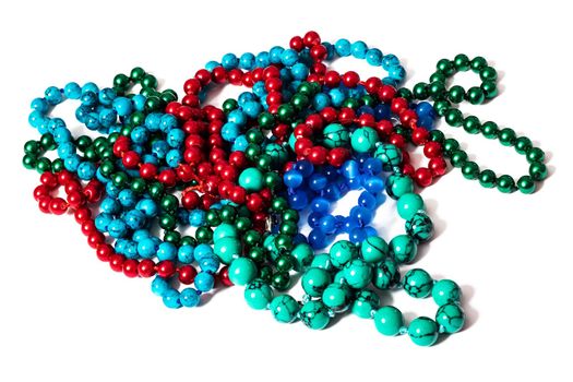 Multicolored beads in a heap, isolate on a white background