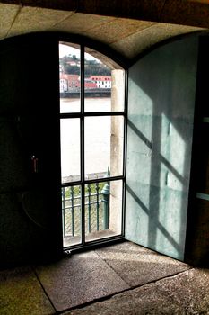 Morning sunlight entering through the window and Porto river in the background.