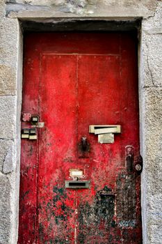 Old and colorful wooden door with iron details in Lisbon, Portugal