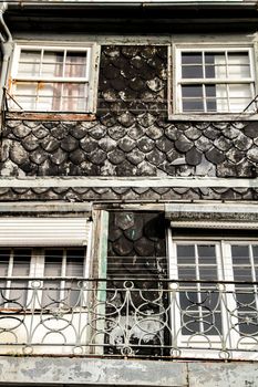 Beautiful and old colorful tiled facades in Porto city in January