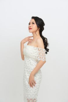 Gorgeous, asian bride in white luxury dress