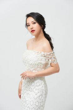 Gorgeous, asian bride in white luxury dress