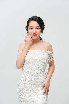 Young bride in a luxurious white wedding dress and beautiful hair. 