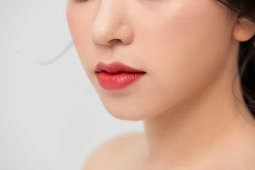 Close-up shot of woman lips with red lipstick. Beautiful perfect lips. Sexy mouth close up. Beautiful wide smile of young fresh woman with full lips