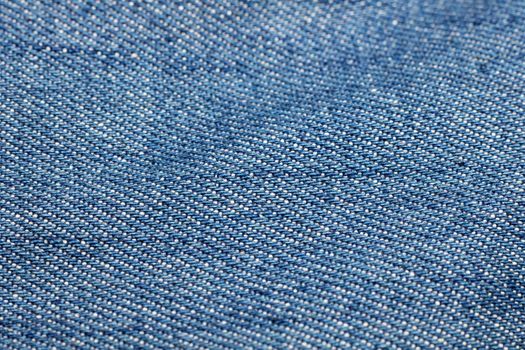 Blue denim fabric close up, background or texture, macro photo