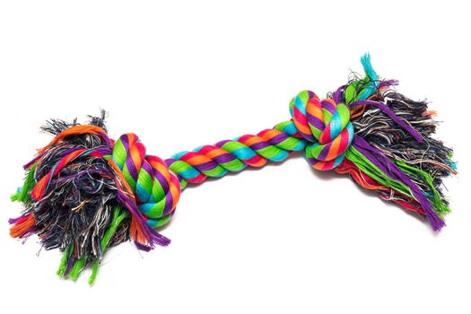 Multi-colored toy rope for dogs close up, isolated on white background