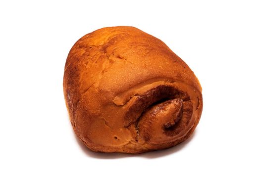 Ruddy cinnamon bun close up, isolated on a white background