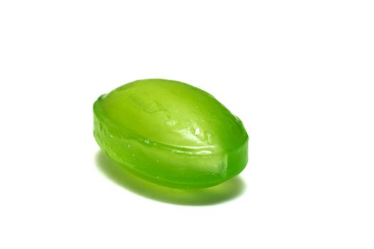 Green candy lollipop close up, isolated on a white background