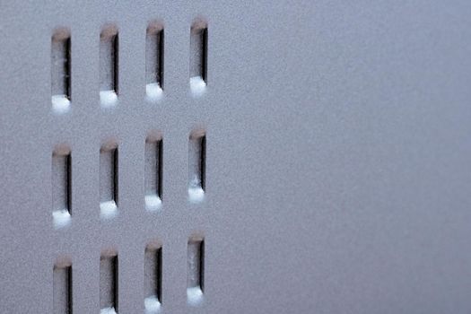 The grille on the metal surface close up, copy space