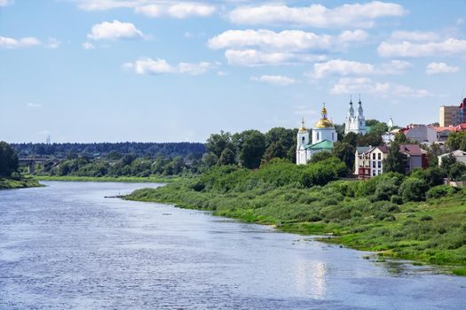 Houses of a small town by the river in summer