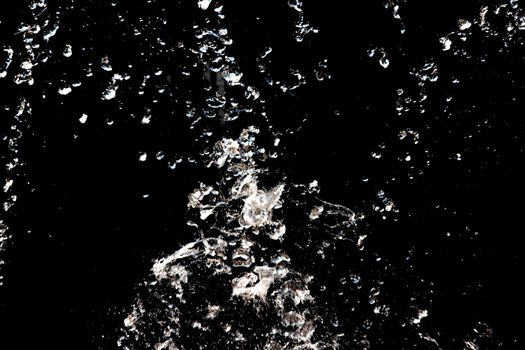 Water splash on a black background close up, copy space