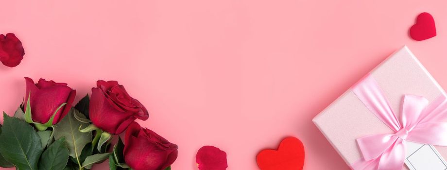 Valentine's Day design concept background with rose flower and gift box on pink background