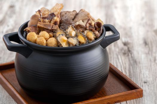 Traditional food of Chinese lunar new year, Buddha jumps over the wall, Chinese Soup Casserole dish, Buddha's Temptation, named Fo Tiao Qiang, close up.