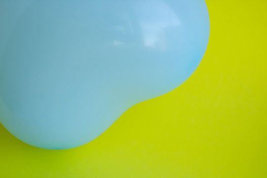Blue balloon in the shape of a heart on a yellow background. Wedding concept, Valentine's Day, photo zone, lovers. Banner. top view.