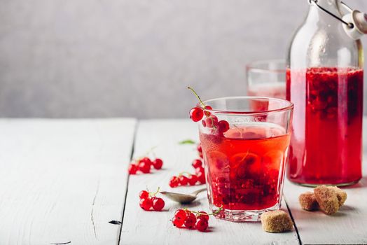 Infused water with fresh red currant and cane sugar