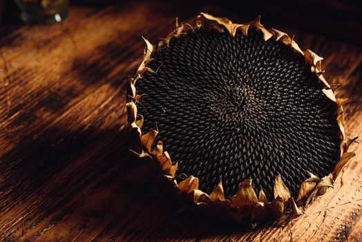 Dried sunflower head on the wooden table