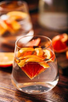 Detox water with blood oranges in drinking glass